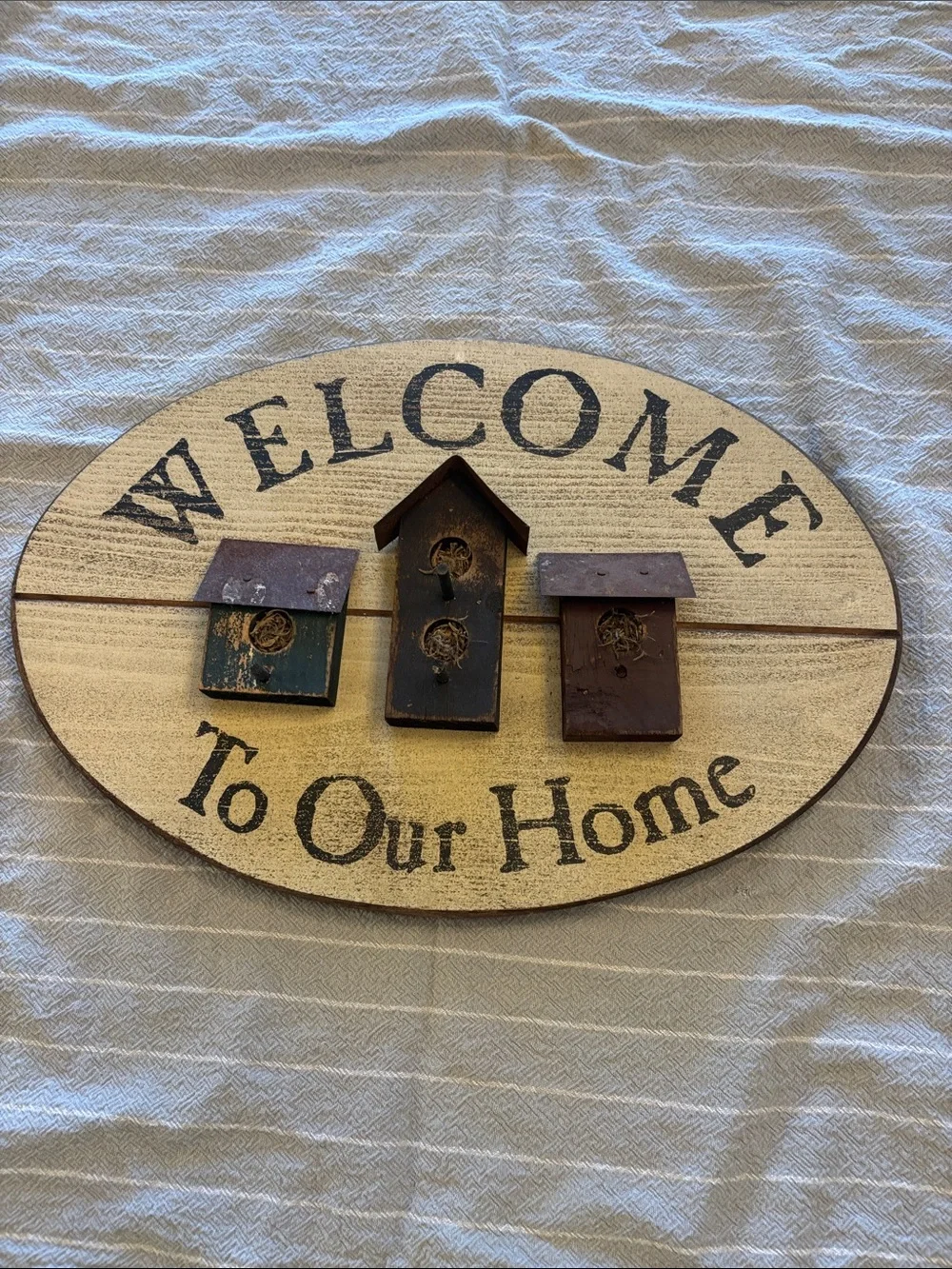 Vintage Welcome Sign with Blue, Black, and Brown Birdhouses